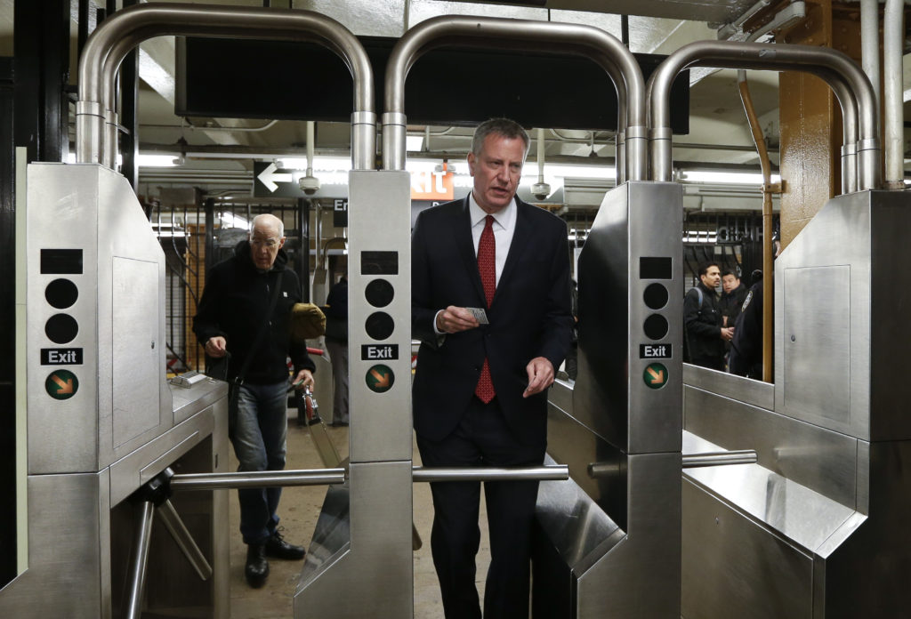 Mayor Bill de Blasio and City Council speaker Corey Johnson on Friday announced details of a limited and late half-priced MetroCard program for low-income New Yorkers. Advocates have recently been criticizing the mayor for the late rollout. AP file photo by Frank Franklin II