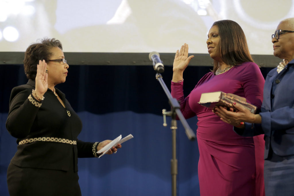 Former Public Advocate Letitia James takes her oath of office as attorney general with the help of former United States Attorney General Loretta Lynch during an inauguration ceremony on Sunday. AP Photo/Seth Wenig