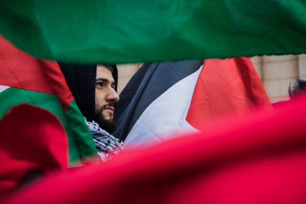 Holding Palestinian flags, demonstrators chanted, “From Palestine to Mexico, all these walls have got to go.”