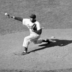 In this Sept. 19, 1956, file photo, Brooklyn Dodgers pitcher Don Newcombe throws against the St. Louis Cardinals at Ebbets Field in New York. AP Photo/File