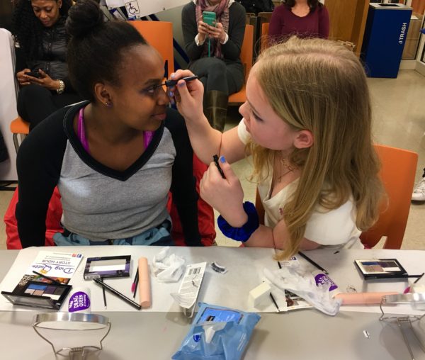 Girls putting on makeup for Brooklyn Public Library's Drag Queen Story Hour. Photo by Lore Croghan.