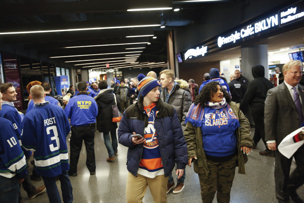 Fans walk along the concourse at Barclays Center ahead of an Islanders game on Jan. 15. AP Photo/Kevin Hagen
