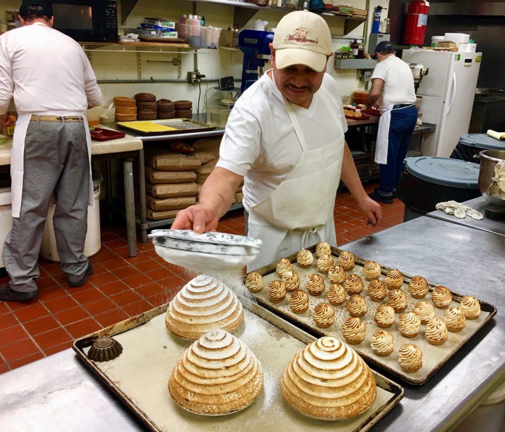Bakers work their magic in Pasticceria Monteleone’s kitchen in Carroll Gardens. Eagle photo by Lore Croghan