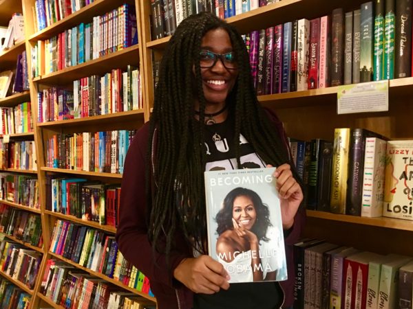 Kim Small recommends Michelle Obama’s memoir “Becoming” as a must-read book during Women’s History Month. Eagle photo by Lore Croghan