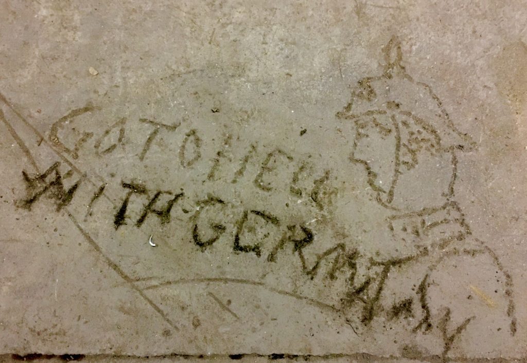 This enigmatic drawing is scratched into the basement floor at 204 Van Dyke St. Eagle photo by Lore Croghan