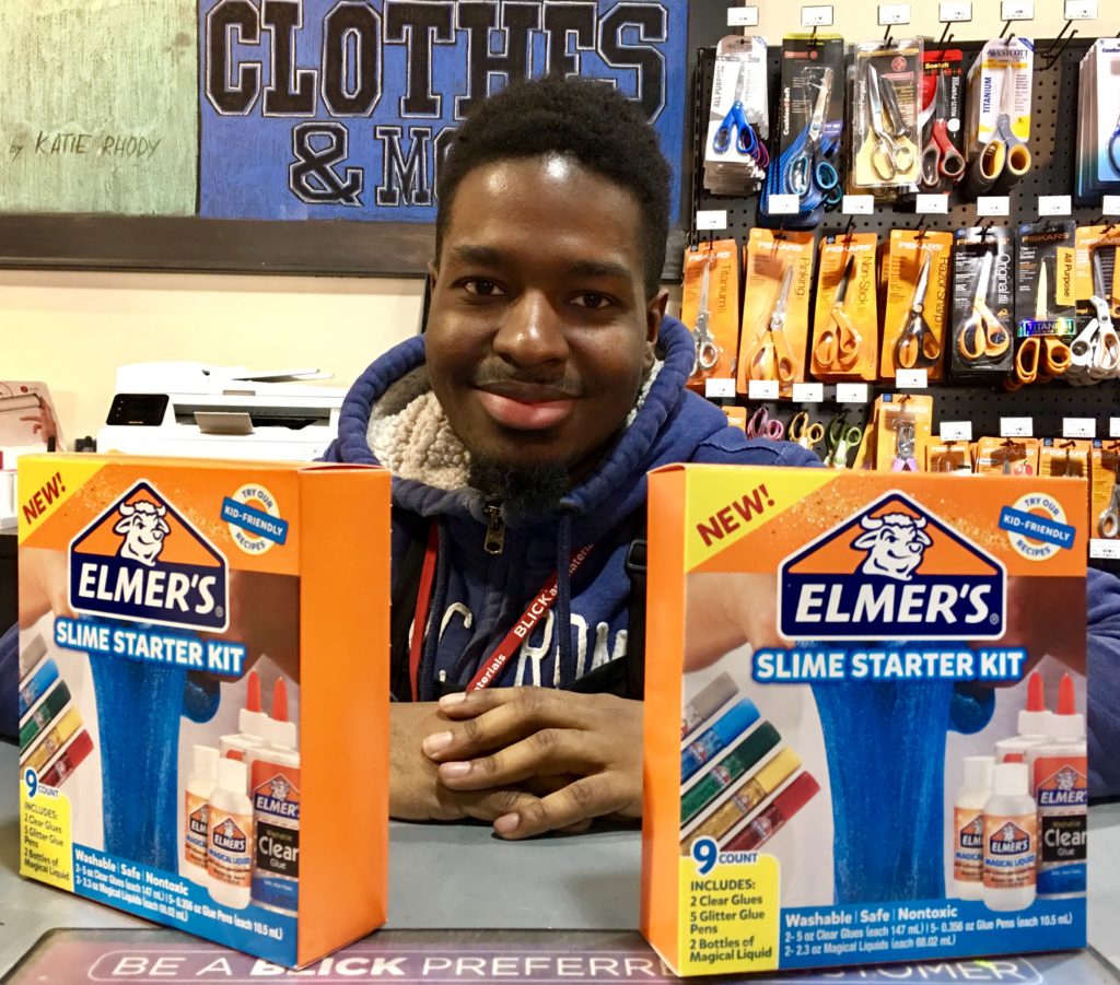 Stephane Jean-Philippe poses with the Elmer’s Slime Starter Kit that Blick Art Materials sells. Eagle photo by Lore Croghan.