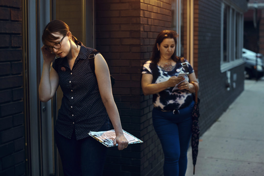 Democratic socialist activist, Leslie Jones (left) knocks on doors with an escort who goes by the name Lana Marciano (right) as they canvass in August for Julia Salazar during her run for State Senate. Salazar supports decriminalizing sex work and repealing laws that target people in the sex industry. AP Photo/Andres Kudacki
