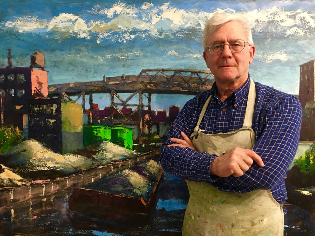 Here’s Carroll Gardens painter Ken Rush in his studio with his oil painting “Gowanus View” in the background. Eagle photo by Lore Croghan