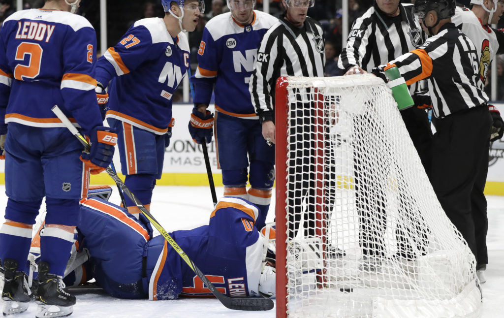 Adding insult to potential injury, Robin Lehner was bowled over in his own crease and may be out the next few games after surrendering a controversial goal during the Islanders’ 5-4 shootout victory over Ottawa on Tuesday night in Uniondale, N.Y. AP Photos/Kathy Willens