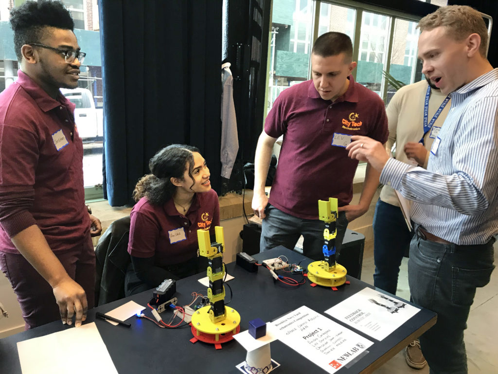 Christian Jean-Simon, Anisha Cartagena and Lev Gurvits demonstrated their Feedback Controlled RoboArm, in which a robot arm mimicked the movements of its sister arm. The project took first place. Eagle photo by Mary Frost