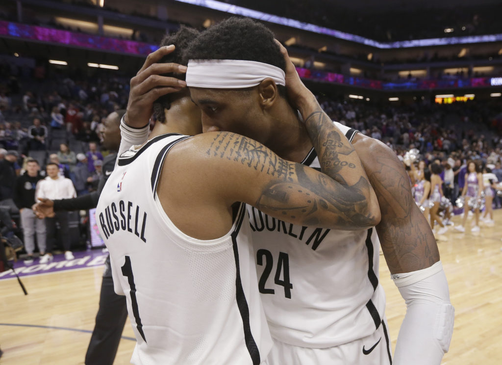 D’Angelo Russell (left) gives Rondae Hollis-Jefferson some love after the duo helped the Nets overcome a 25-point, fourth-quarter deficit during Tuesday night’s epic comeback win in Sacramento.(AP Photo/Rich Pedroncelli)
