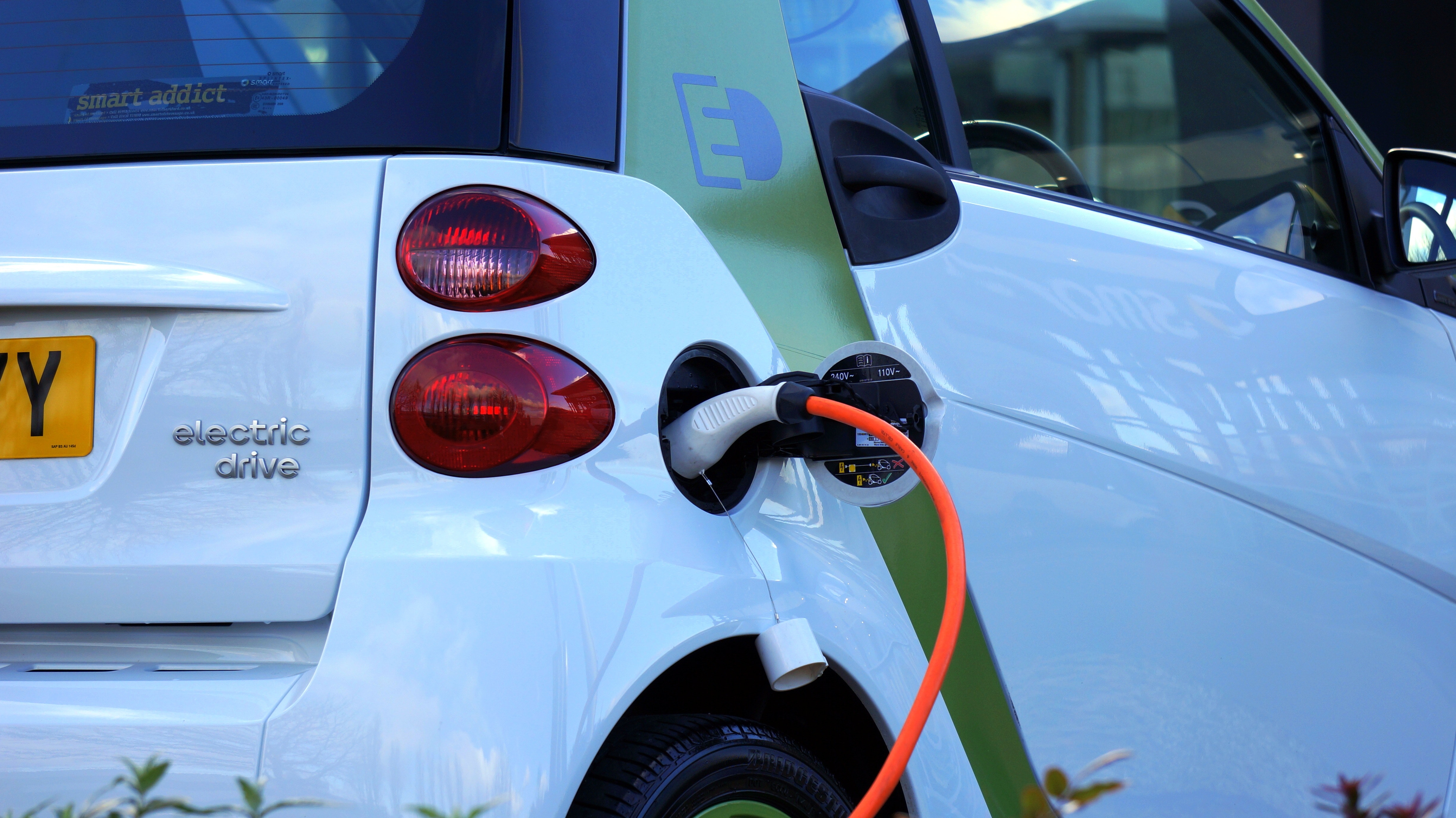 An electric vehicle bring charged. Photo via Mikes Photos / Pexels.