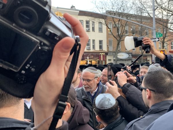 Former New York State Assemblymember Dov Hikind chanted “Down with terrorism,” with his arm around a member of the Jewish Defense League. Eagle photo by Noah Goldberg.