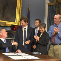 Stephen Levin is one of nine Brooklyn councilmembers scoring 100 percent in a scorecard released on March 8 by the New York League of Conservation Voters. He is shown above congratulating Mayor Bill de Blasio at the signing of a bill prohibiting the use of fracking products in the city. File photo courtesy of Levin’s office