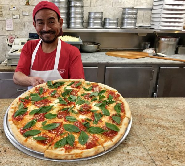 Gilberto Rodriguez shows me a margherita pie at Tony’s Pizza. Eagle photo by Lore Croghan