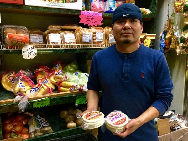 Bertin Vasquez says frozen pupusas are a top-selling item at La Union Deli Grocery on Fifth Avenue. Eagle photo by Lore Croghan