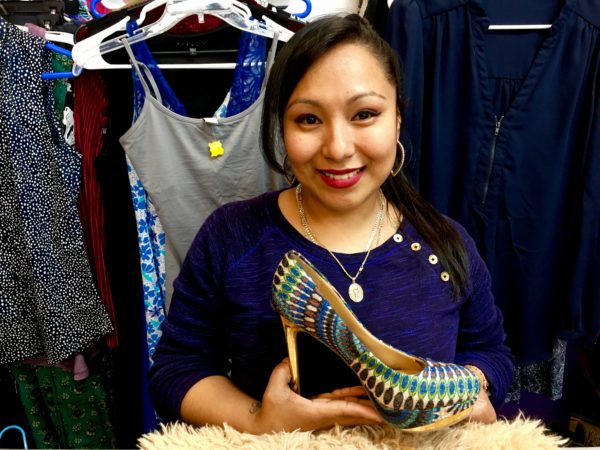 Brenda Flores, who co-owns D & B Vintage, shows off a glamorous stiletto. There’s actually a pair of the shoes, which are priced at $10. Eagle photo by Lore Croghan