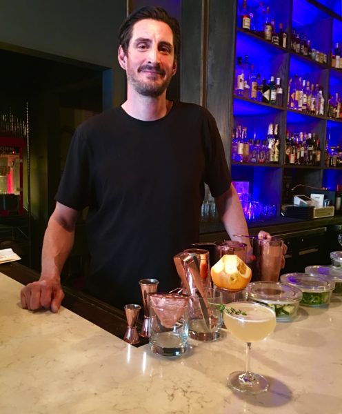 Travis Klaus shows off Bush’s Folly, which is the top-selling drink at L’Wren. Eagle photo by Lore Croghan