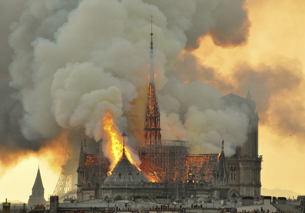 An inferno that raged through Notre Dame Cathedral on April 15 for more than 12 hours destroyed its spire and its roof. AP Photo/Thierry Mallet