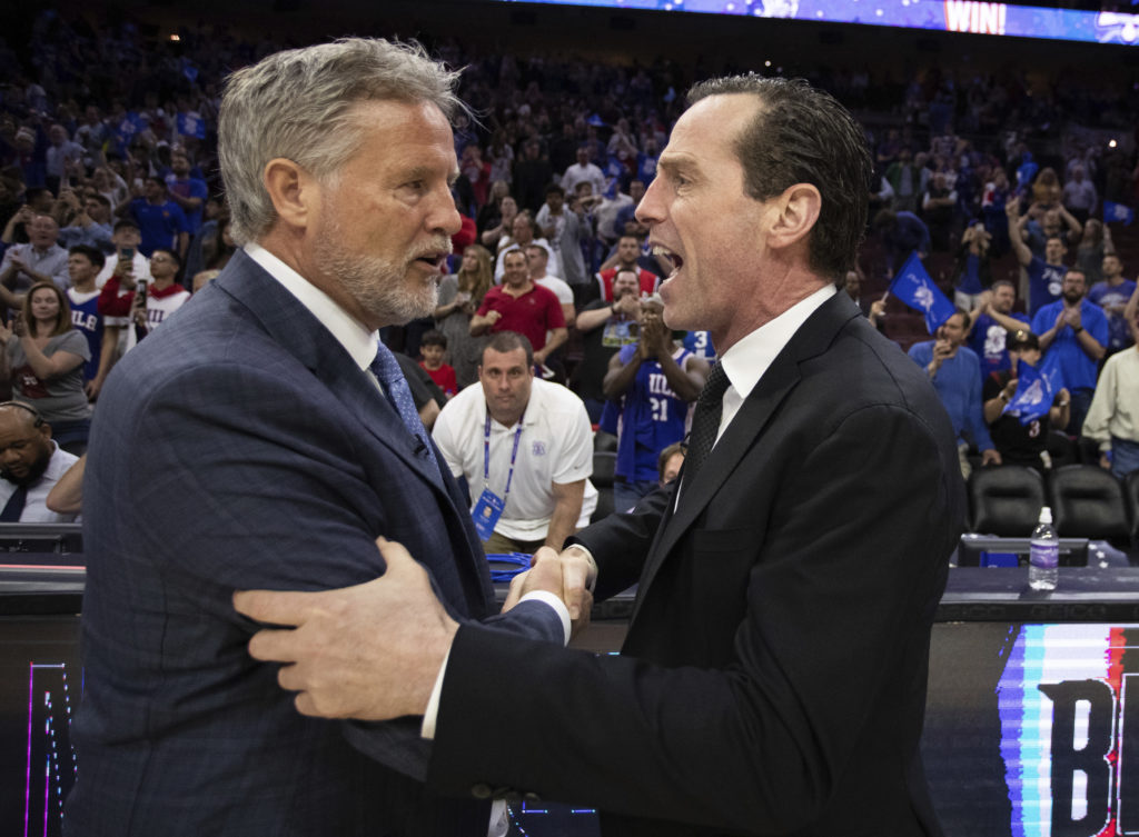 Nets head coach Kenny Atkinson congratulates the Sixers’ Brett Brown following a hard-fought but ultimately one-sided playoff series that ended Brooklyn’s impressive turnaround season.(AP Photo/Chris Szagola)