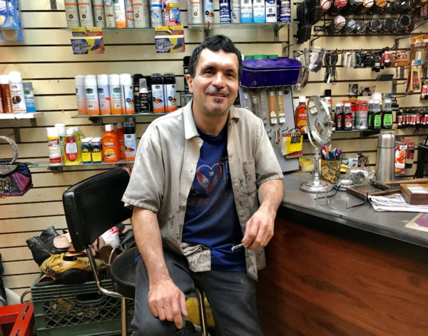 Fernando Castano, who has worked at the Clark Street subway station’s shoe repair shop, Brooklyn Heights Shoe Master, for more than 18 years, said the station’s rumored year-long closure could put the shop out of business. Eagle photo by Mary Frost