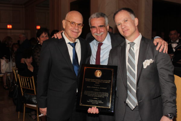 Hon. William Miller (left) and Christopher Wright (right) present Hon. Joseph Gubbay with the Gustin L. Reichbach Judicial Recognition Award. Eagle photo by Mario Belluomo