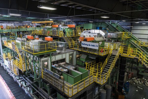 The facility’s main room is equipped with 2.5 miles of conveyor belts, magnets, infrared cameras and other machinery to help sort the recyclable materials.