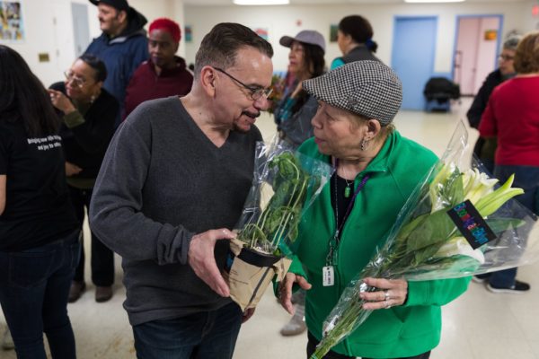 Members at the senior center bond over their new plants. Eagle photo by Paul Frangipane