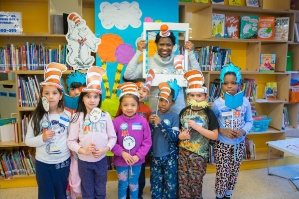 D. Bernadette Neckles poses with kids from P.S. 274 in Bushwick during a celebration of Dr. Seuss' birthday in 2018. Neckles goes to the school each year with other members of the Brooklyn Women's Bar Association to read to kindergarten and first-grade students as part of Read Across America. Eagle file photo by Rob Abruzzese