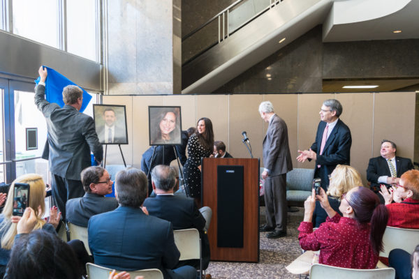 Hon. Bernard Graham unveils portraits of the Employees of the Year that will be hung in their respective courthouses. Eagle photo by Rob Abruzzese