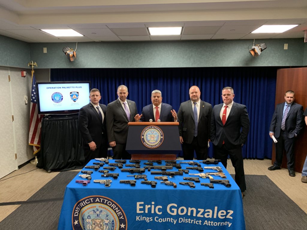 Brooklyn District Attorney Eric Gonzalez announces the indictment of three men accused of running a Brooklyn gun-trafficking ring. Eagle photo by Noah Goldberg.