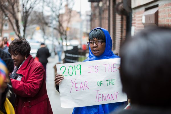 Tenants brought signs and chanted for a meeting with their landlord to discuss repairs. Eagle photo by Paul Frangipane