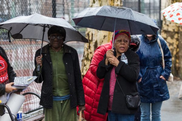 Beryl Steward, left, and Viola Bibins at the protest. Steward recently underwent an operation in her leg and has trouble climbing the five flights of stairs to her apartment while the building’s elevator is broken. Eagle photo by Paul Frangipane