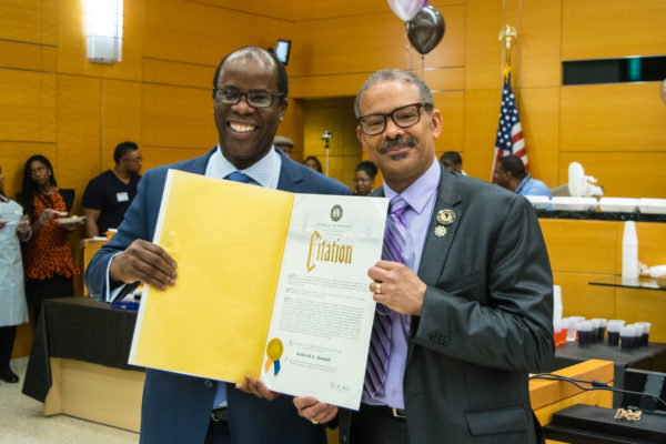 Chief Clerk Charles Small (left) presented Rod Randall with a citation on behalf of Borough President Eric Adams’ office. Eagle photo by Rob Abruzzese