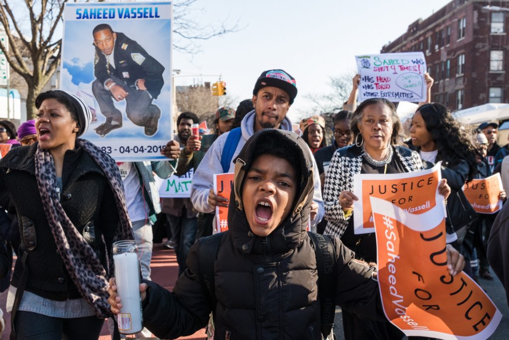 Family, friends and neighbors of Saheed Vassell took to the streets in Crown Heights on Thursday to march in remembrance on the anniversary of Vassell's death. Eagle photo by Paul Frangipane