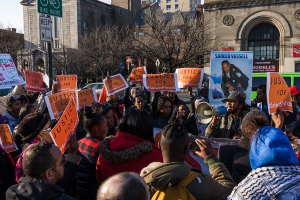 Saheed Vassell’s close friend Henry Emmanuel Christian spoke to the crowd on Eastern Parkway. "He had love in his heart," Christian said. Eagle photo by Paul Frangipane