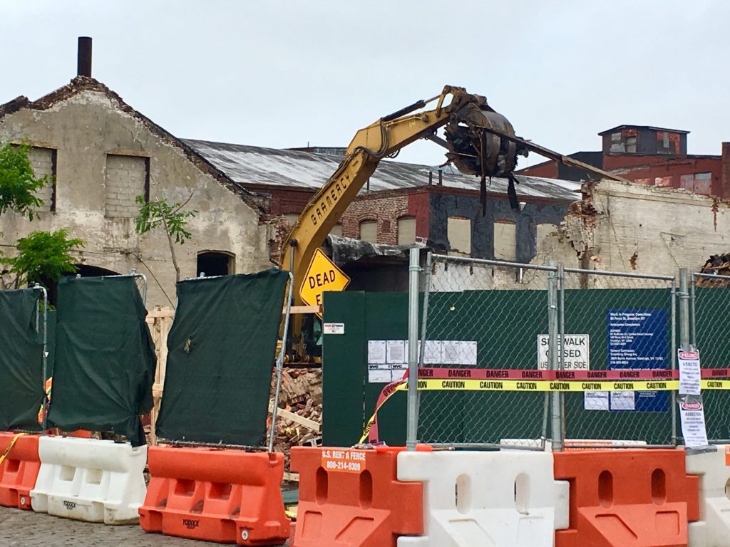 Bulldozers are busy on Thursday, May 30, at the site of Red Hook’s historic Lidgerwood Building. Eagle photo by Lore Croghan