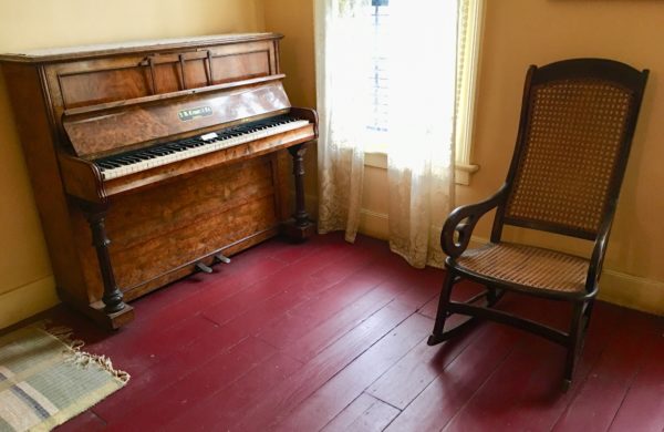 There’s a piano in the “best room” — that’s a synonym for parlor — at 1700 Bergen St. Eagle photo by Lore Croghan