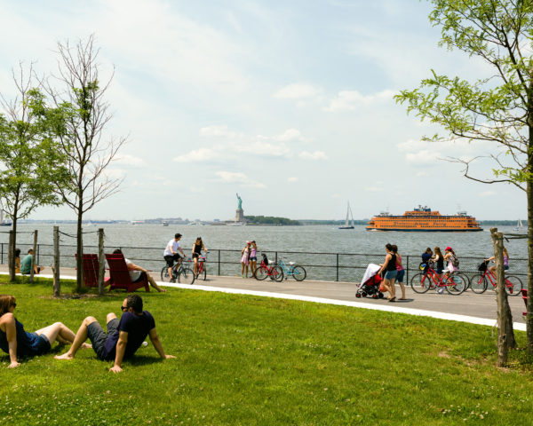 Parkgoers lounge on the grass. Photo by Kreg Holt