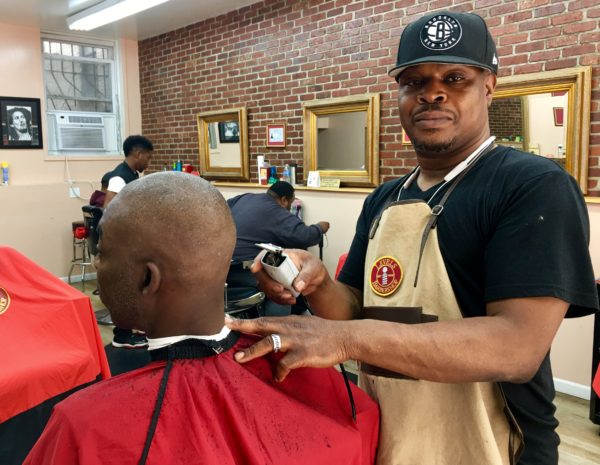 Donald Ramel, seen here cutting hair, hopes the proposed Spice Factory development brings Levels Barbershop new customers. Eagle photo by Lore Croghan