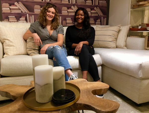 Brooke Sweeney (at left) and Natalie Morgan (at right) are employees at Items of Interest, where a sleeper sofa with a platform bed is a big seller. Eagle photo by Lore Croghan