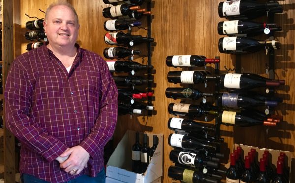 Cory Hill, owner of Wet Whistle Wines, says constant change is the norm in America. Eagle photo by Lore Croghan