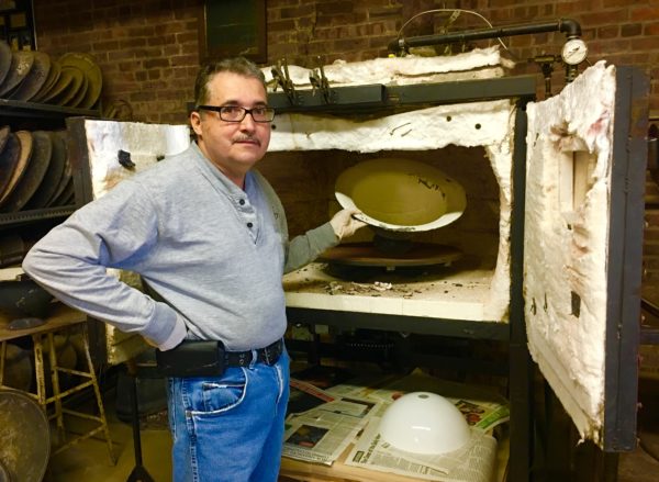 Ezequiel Alicea of Flickinger Glassworks thinks old buildings should be “respected” instead of demolished. Eagle photo by Lore Croghan