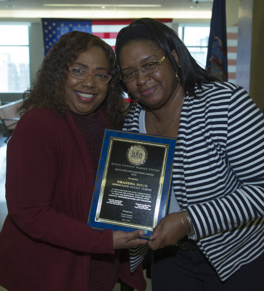 Grace Harper presents Shandra Rhue with her award. Eagle photo by Andy Katz
