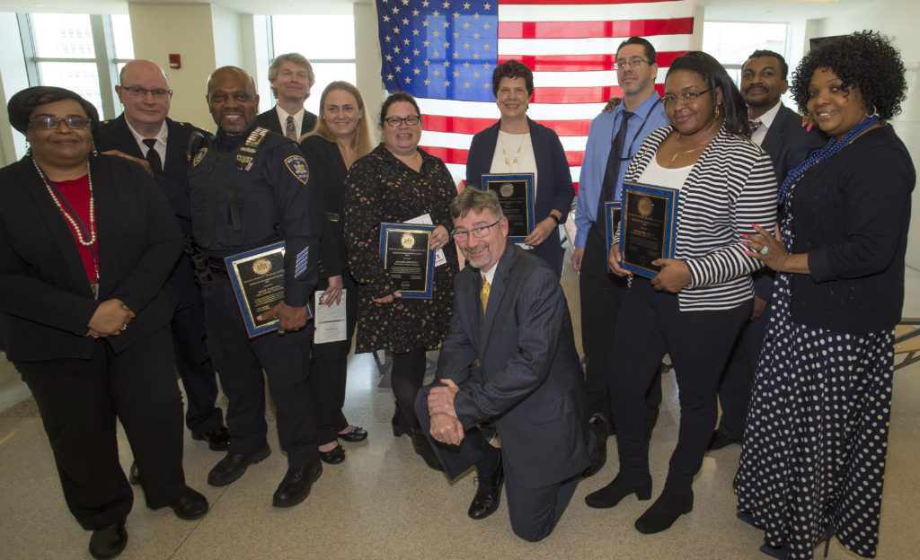 Award winners and court staff pose after the Law Day ceremony. From left, Captain John Posillipo, Officer Rick Carter, Gordon Flannery, Dinah Gronda, John Coakley, Zuzana Vojtek, Dennis Gillooly, Shandra Rhue, Ryan Darshan and Dionne Lowery. Eagle photo by Andy Katz