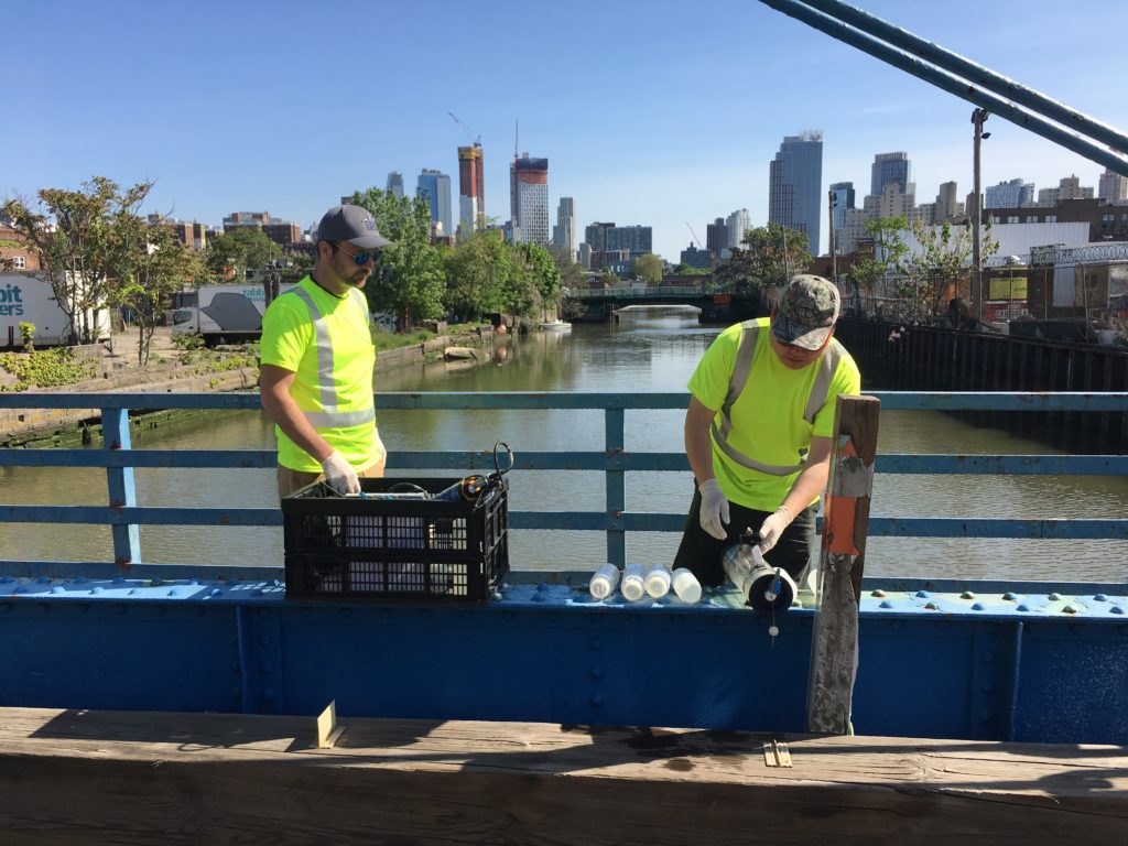 NYCDEP employees take water samples of the Gowanus Canal. Photo by Scott Enman