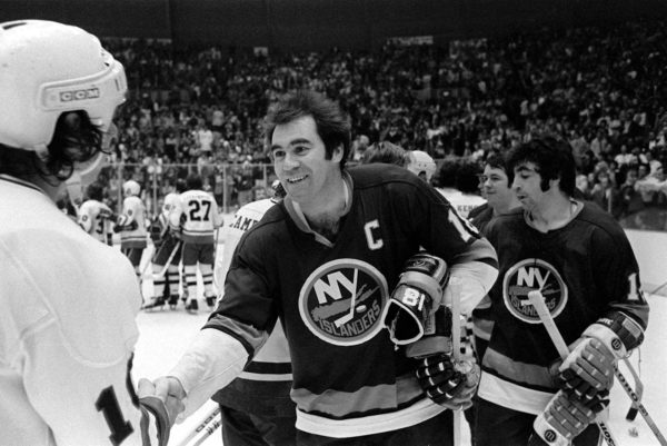 Former Islanders team captain Eddie Westfall shakes hands with the Pittsburgh Penguins back in 1975 after the Islanders overcome an 0-3 series deficit to advance to the Stanley Cup semifinals.(AP Photo/Gene Blyth)