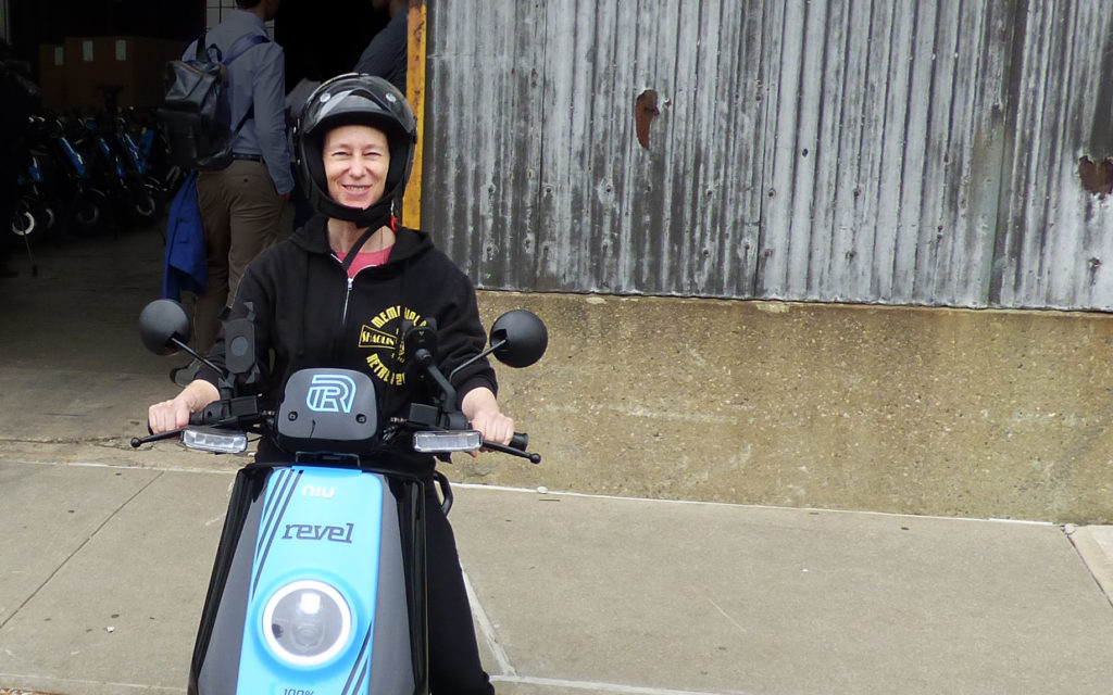 Brooklyn Eagle reporter Mary Frost tries out one of the 1,000 rideshare mopeds being distributed across Brooklyn and Queens this week. Photo by Daniella Henry