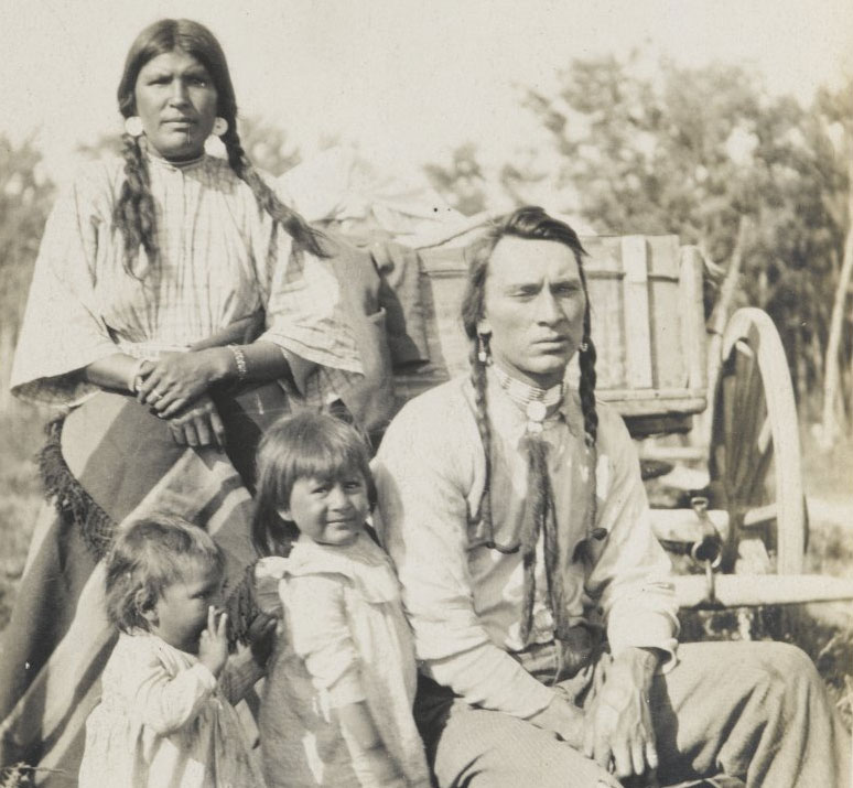 A Native American family poses for a portrait around 1900. Photo via Brooklyn Museum