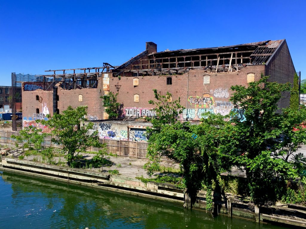 Due to recent demolition work, part of the S.W. Bowne Grain Storehouse’s facade is gone now. Eagle photo by Lore Croghan